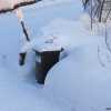 arbage bin has find a proper fence around - from snow