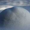 one metre high triangular spruce under snow