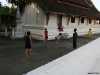 children on temple courtyard luang prapang