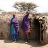 masai couple in front of their house in Ngorongoro