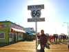 Vesa at the End of Trail 66 sign in Santa Monica Pier California