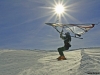 skisurfer jumping into prepared slope
